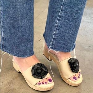 CHANEL Cream and Black Sandals with Elegant Flower Detail
